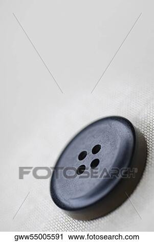 Stock Image - Close-up of a button. Fotosearch