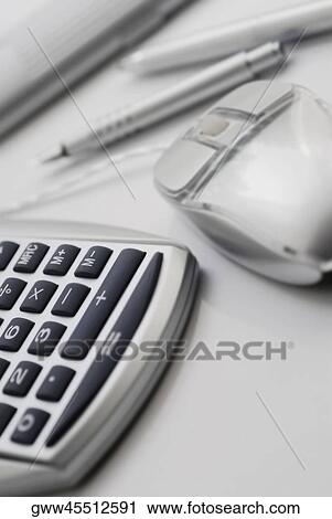 Close-up of a calculator and a computer mouse with a ballpoint pen View Large Photo Image Stock Image - Close-up of a calculator and a computer mouse with a ballpoint pen. Fotosearch