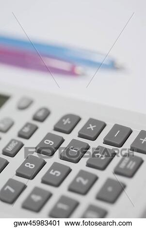 Close-up of a calculator with two pens View Large Photo Image Stock Image - Close-up of a calculator with two pens. Fotosearch