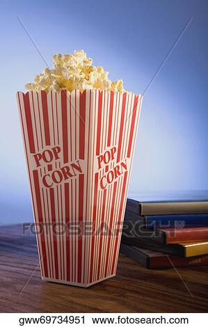 Close-up of a carton of popcorn and diaries View Large Photo Image Stock Image - Close-up of a carton of popcorn and diaries. Fotosearch