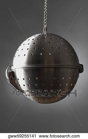 Close-up of a colander hanging on a chain View Large Photo Image Stock Image - Close-up of a colander hanging on a chain. Fotosearch