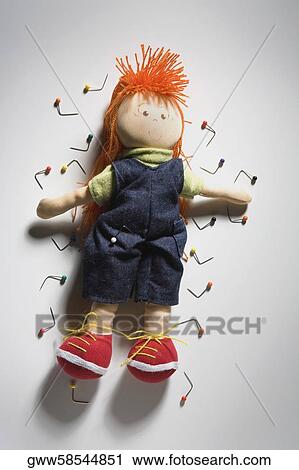 Close-up of a doll surrounded by thumbtacks View Large Photo Image Stock Image - Close-up of a doll surrounded by thumbtacks. Fotosearch