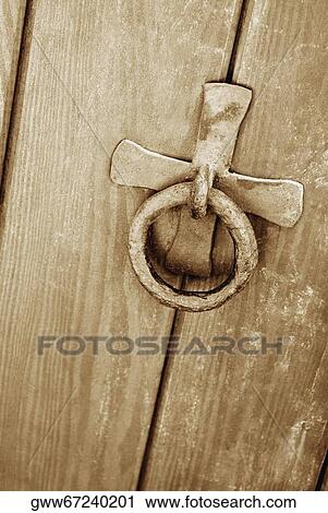 Stock Image - Close-up of a doorknocker on a door. Fotosearch