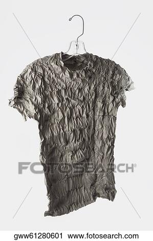 Close-up of a dress hanging on a hanger View Large Photo Image Stock Image - Close-up of a dress hanging on a hanger. Fotosearch