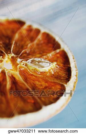 Stock Image - Close-up of a dried slice of lemon. Fotosearch