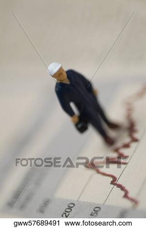 Close-up of a figurine on a graph line View Large Photo Image Stock Image - Close-up of a figurine on a graph line. Fotosearch