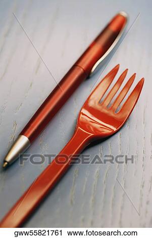Stock Image - Close-up of a fork and a pen. Fotosearch