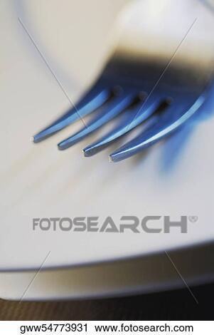 Close-up of a fork on a plate View Large Photo Image Stock Image - Close-up of a fork on a plate. Fotosearch