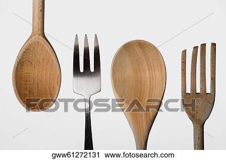 Close-up of a fork with a wooden spoon View Large Photo Image Stock Image - Close-up of a fork with a wooden spoon. Fotosearch
