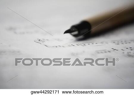 Close-up of a fountain pen on paper View Large Photo Image Stock Image - Close-up of a fountain pen on paper. Fotosearch