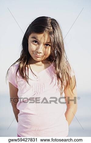 Stock Image - Close-up of a girl making a face. Fotosearch