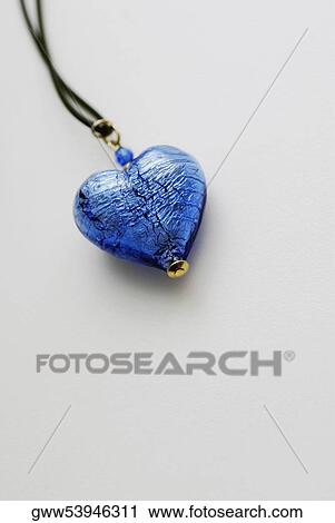 Close-up of a heart shaped pendant in a string View Large Photo Image Stock Image - Close-up of a heart shaped pendant in a string. Fotosearch