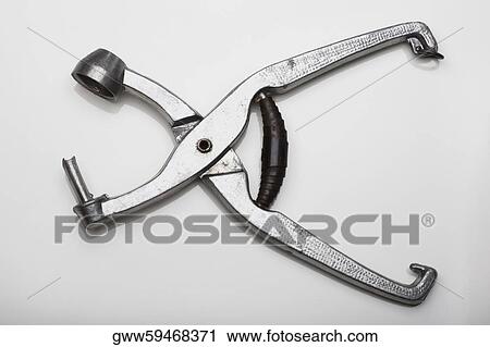 Close-up of a hole puncher View Large Photo Image Stock Image - Close-up of a hole puncher. Fotosearch