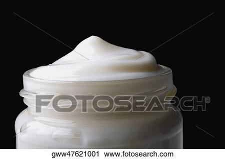 Stock Image - Close-up of a jar full of moisturizer. Fotosearch