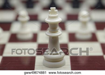 Close-up of a king chess piece on a chessboard View Large Photo Image Stock Image - Close-up of a king chess piece on a chessboard. Fotosearch