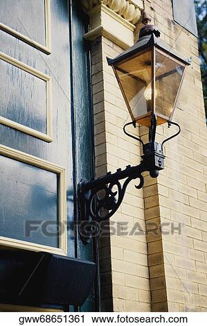 Close-up of a lantern outside a building View Large Photo Image Stock Image - Close-up of a lantern outside a building. Fotosearch