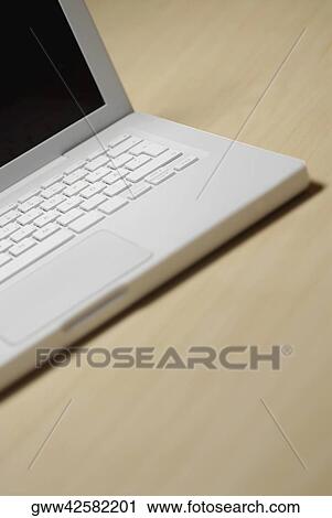 Close-up of a laptop on the table View Large Photo Image Stock Image - Close-up of a laptop on the table. Fotosearch