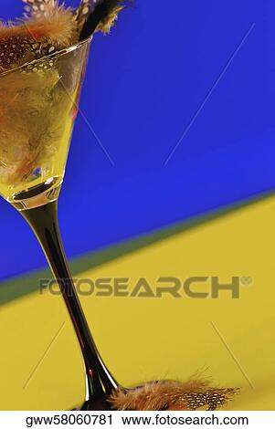 Close-up of a martini glass full of feathers View Large Photo Image Stock Image - Close-up of a martini glass full of feathers. Fotosearch