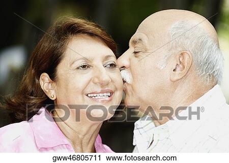 Close-up of a mature man kissing a mature woman View Large Photo Image Stock Image - Close-up of a mature man kissing a mature woman. Fotosearch