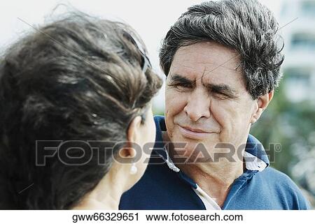 Close-up of a mature man looking at a mature woman View Large Photo Image Stock Image - Close-up of a mature man looking at a mature woman. Fotosearch