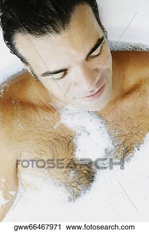 Close-up of a mature man taking bubble bath View Large Photo Image Stock Image - Close-up of a mature man taking bubble bath. Fotosearch