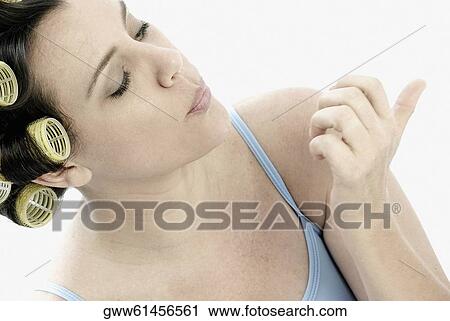 Close-up of a mature woman drying her nail polish on her fingernails View Large Photo Image Stock Image - Close-up of a mature woman drying her nail polish on her fingernails. Fotosearch