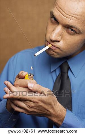 Close-up of a mid adult man smoking View Large Photo Image Stock Image - Close-up of a mid adult man smoking. Fotosearch