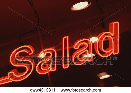 Close-up of a neon sign lit up at night View Large Photo Image Stock Image - Close-up of a neon sign lit up at night. Fotosearch