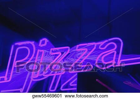 Close-up of a neon sign lit up at night View Large Photo Image Stock Image - Close-up of a neon sign lit up at night. Fotosearch