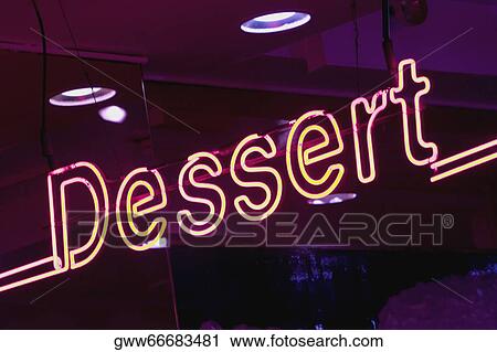 Close-up of a neon sign lit up at night View Large Photo Image Stock Image - Close-up of a neon sign lit up at night. Fotosearch