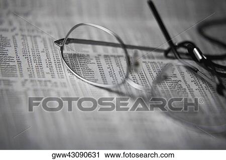 Close-up of a pair of eyeglasses on a financial page View Large Photo Image Stock Image - Close-up of a pair of eyeglasses on a financial page. Fotosearch