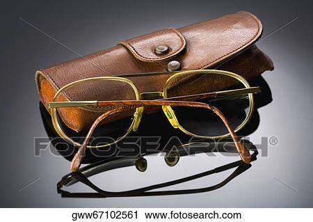 Close-up of a pair of eyeglasses with a spectacle case View Large Photo Image Stock Image - Close-up of a pair of eyeglasses with a spectacle case. Fotosearch