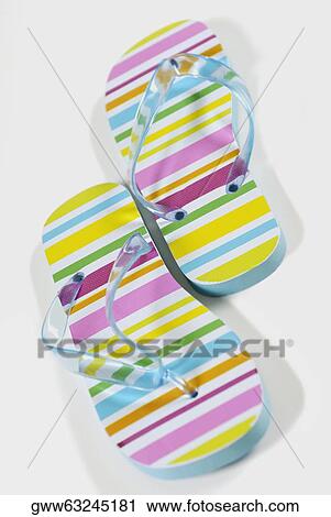 Stock Image - Close-up of a pair of flip-flops. Fotosearch