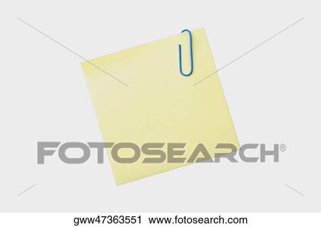 Close-up of a paper clip on a sheet of paper View Large Photo Image Stock Image - Close-up of a paper clip on a sheet of paper. Fotosearch