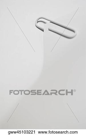 Close-up of a paper clip on blank paper View Large Photo Image Stock Image - Close-up of a paper clip on blank paper. Fotosearch