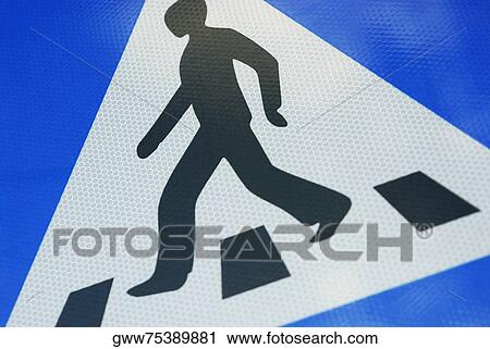 Stock Image - Close-up of a pedestrian crossing sign. Fotosearch
