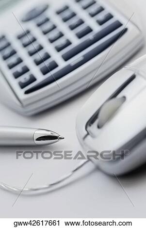 Close-up of a pen and computer mouse with a calculator View Large Photo Image Stock Image - Close-up of a pen and computer mouse with a calculator. Fotosearch