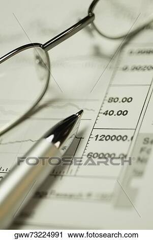 Close-up of a pen and eyeglasses on a financial document View Large Photo Image Stock Image - Close-up of a pen and eyeglasses on a financial document. Fotosearch