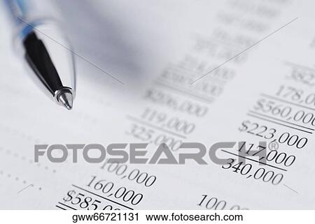 Close-up of a pen on a financial document View Large Photo Image Stock Image - Close-up of a pen on a financial document. Fotosearch