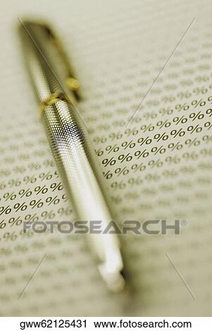 Close-up of a pen on a paper with percentage signs View Large Photo Image Stock Image - Close-up of a pen on a paper with percentage signs. Fotosearch