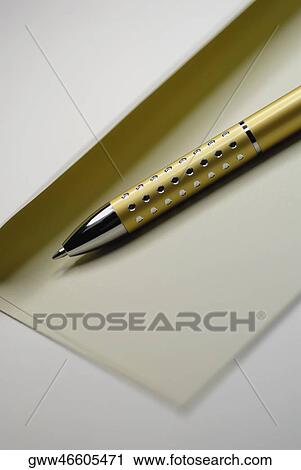 Stock Image - Close-up of a pen on an envelope. Fotosearch