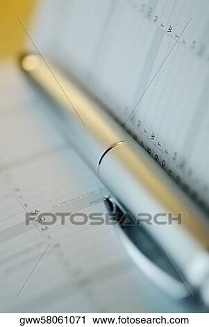 Close-up of a pen with a diary View Large Photo Image Stock Image - Close-up of a pen with a diary. Fotosearch