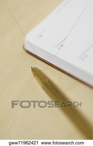 Close-up of a pen with a diary View Large Photo Image Stock Image - Close-up of a pen with a diary. Fotosearch