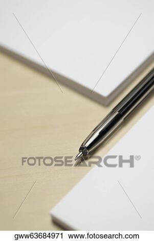 Close-up of a pen with two adhesive note pads View Large Photo Image Stock Image - Close-up of a pen with two adhesive note pads. Fotosearch