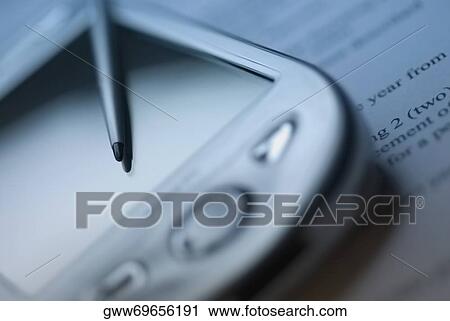 Close-up of a personal data assistant with a digitized pen View Large Photo Image Stock Image - Close-up of a personal data assistant with a digitized pen. Fotosearch