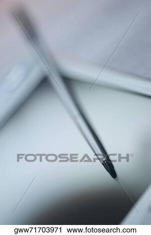 Close-up of a personal data assistant with a digitized pen View Large Photo Image Stock Image - Close-up of a personal data assistant with a digitized pen. Fotosearch