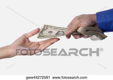 Close-up of a person's hand giving another dollars View Large Photo Image Stock Image - Close-up of a person's hand giving another dollars. Fotosearch
