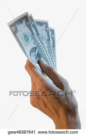 Close-up of a person's hand holding two dollar bills View Large Photo Image Stock Image - Close-up of a person's hand holding two dollar bills. Fotosearch
