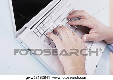 Close-up of a person's hands working on a laptop View Large Photo Image Stock Image - Close-up of a person's hands working on a laptop. Fotosearch