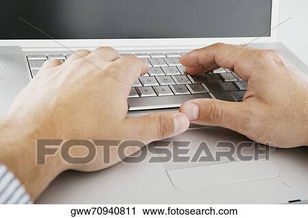 Close-up of a person's hands working on a laptop View Large Photo Image Stock Image - Close-up of a person's hands working on a laptop. Fotosearch